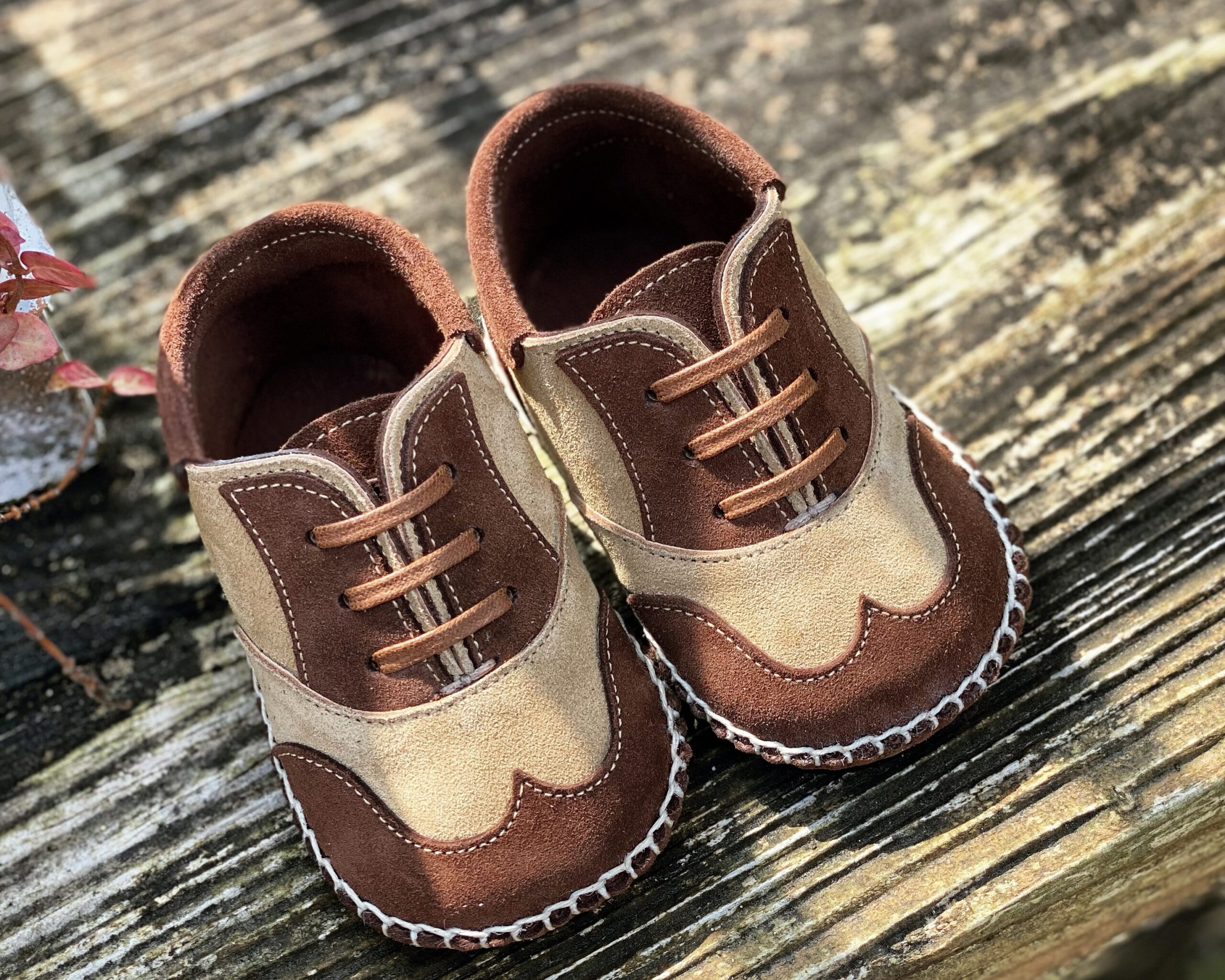 Hand-stitched leather baby shoes using French buffalo leather in Opanke construction