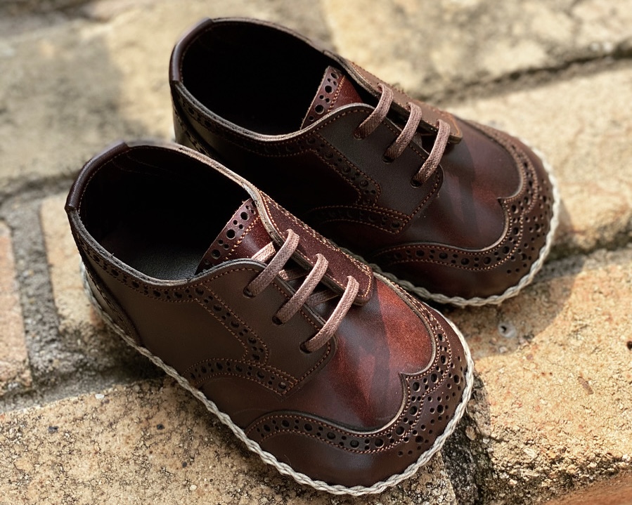 Leather baby shoes presented in a personalized box—popular as commemorative gifts
