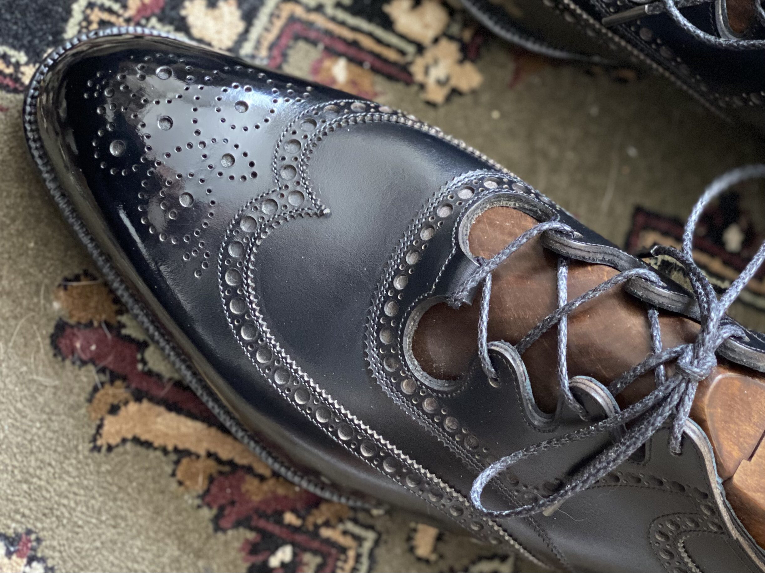 Ghillie shoe showcasing elegant aggression through contrasting curves and straight lines