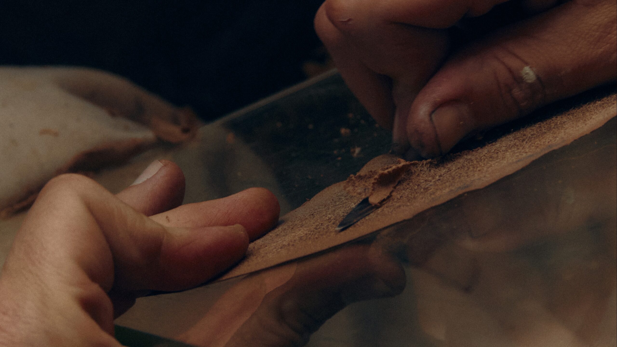 A panoramic view of Laborde’s workshop—tools, lasts, and leathers mapping a decade of study.