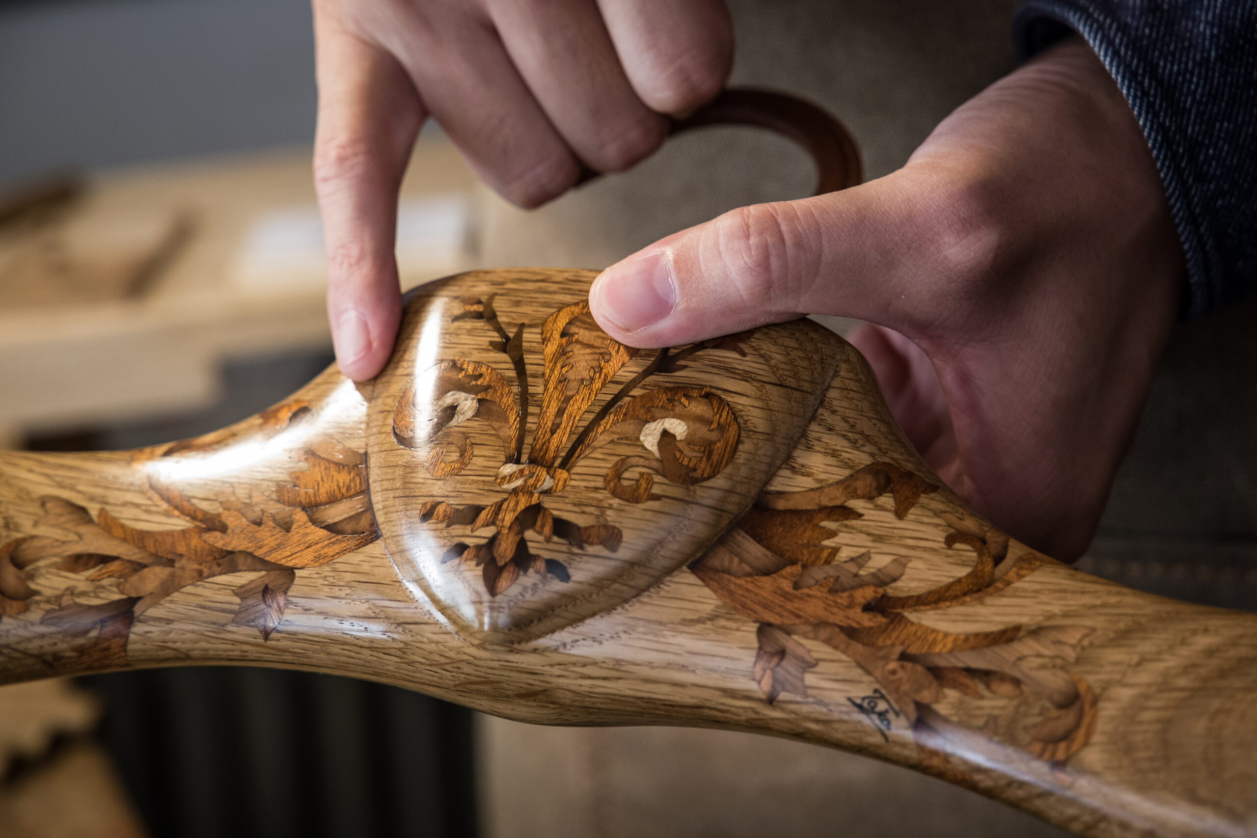 Close-up marquetry: grain direction and tone build contrast from limited woods